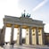 The Brandenburg Gate with 6 columns and a statue of a horse drawn chariot at the top